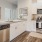 Luxury Three Bedroom Apartments in Reno NV - Vida - Modern Kitchen With Wood-Style Plank Flooring, Stainless Steel Appliances, Quartz Countertops, And Custom Cabinetry