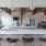 Luxury Apartments in Reno NV - Vida - Clubhouse Area with Shuffle Board, a Glossy Kitchen, Lunge and Seating Area, a TV, and Large Windows